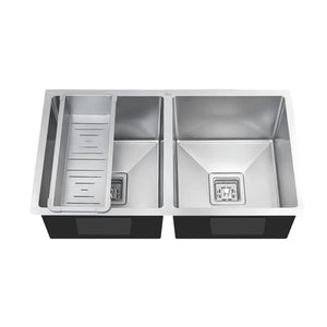 Stainless steel double basin kitchen sink on a white background