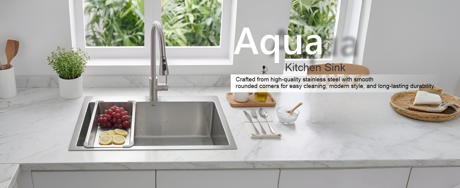 Stainless steel kitchen sink with Aqua branding on a modern kitchen counter.