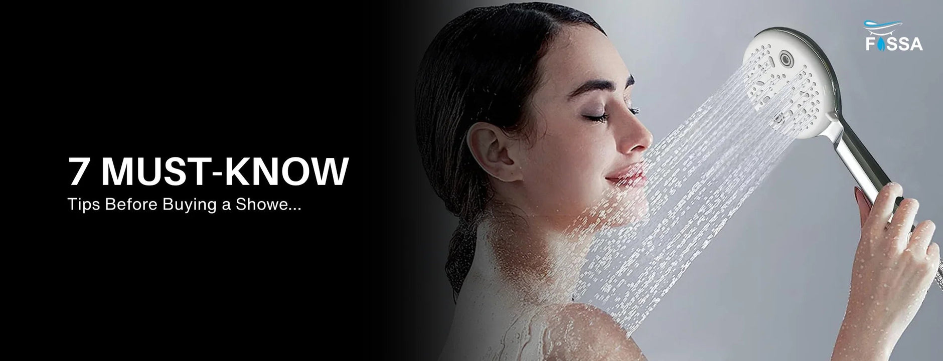 Woman using handheld shower head in bathroom with water spraying