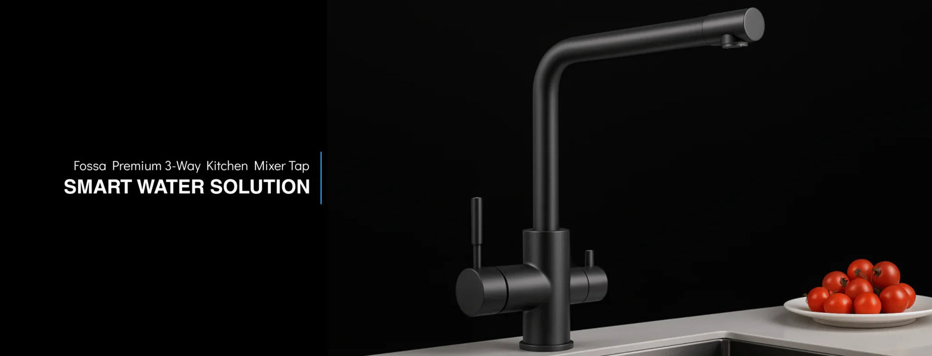Modern black 3-way kitchen mixer tap installed on a countertop with a bowl of tomatoes beside sink