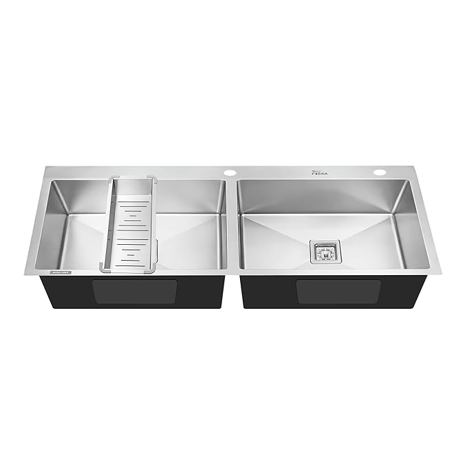 Stainless steel kitchen sink with double basin on a white background