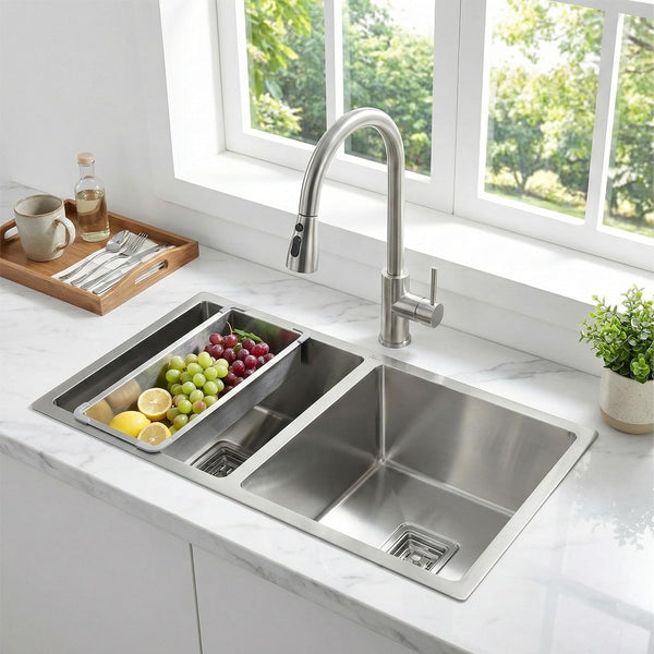Stainless steel kitchen sink with a modern faucet in a bright kitchen setting.