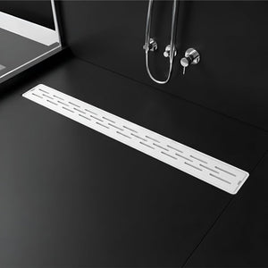 Designed to guide shower water efficiently toward the drain for a cleaner bathroom floor.