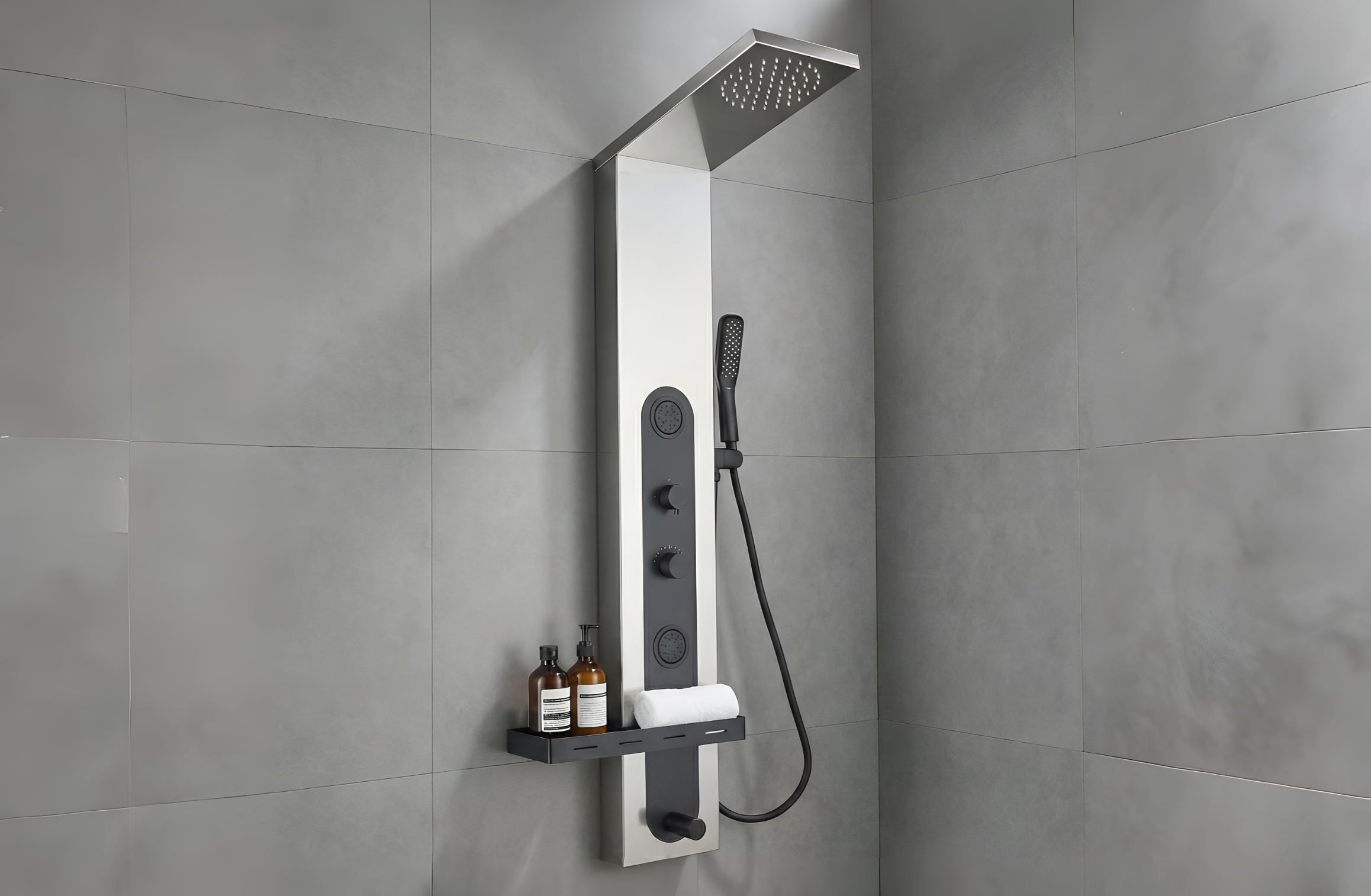 Shower panel with rain shower head and handheld shower on a tiled wall.